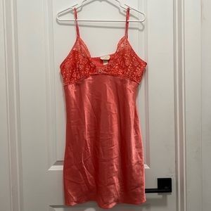 A satin peach color slip dress in size XL